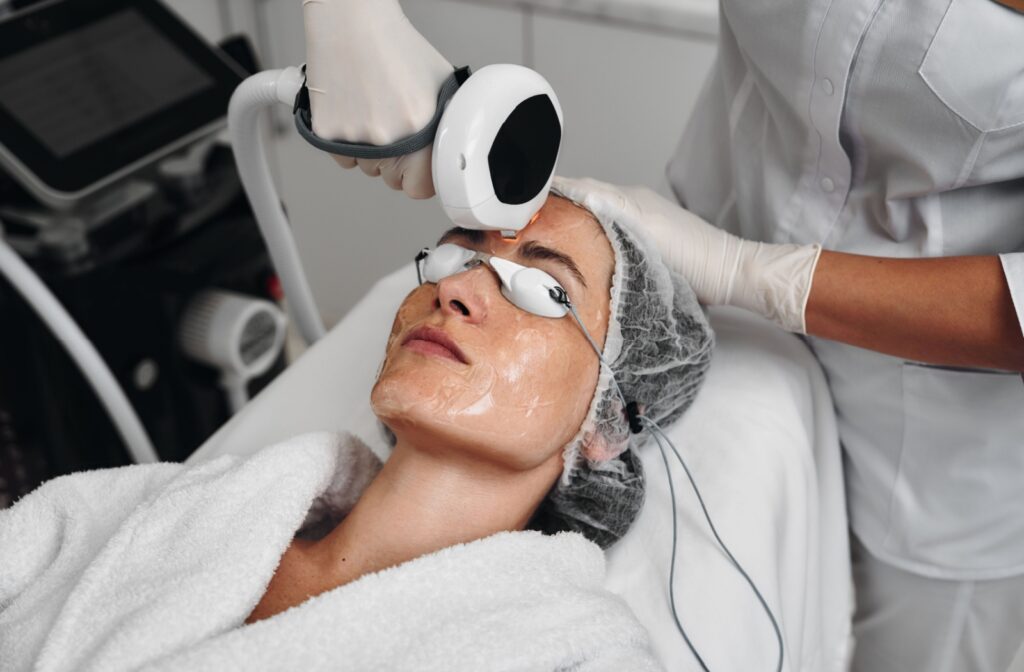 A patient wears protective goggles during their IPL dry eye therapy session.