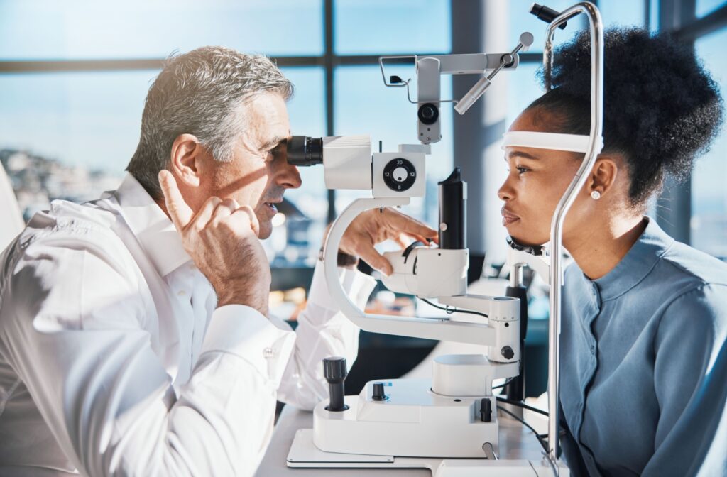 An optometrist uses a slit lamp to evaluate the severity of a patient's dry eye.